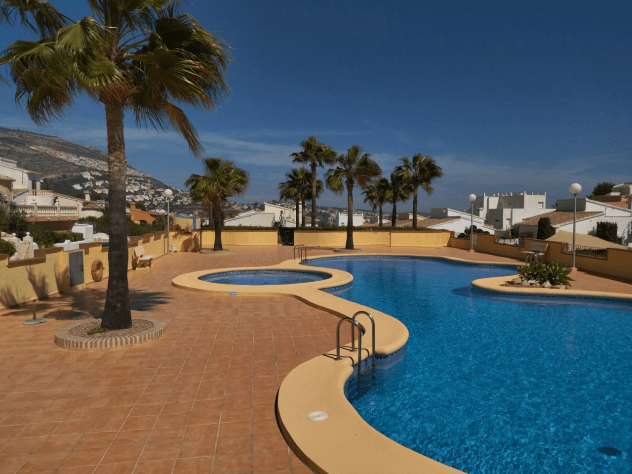 Cumbre del Sol Villa with sea views and communal pool.